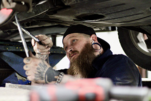 Technician Working Under Vehicle | Garvin & Lidster Auto Service